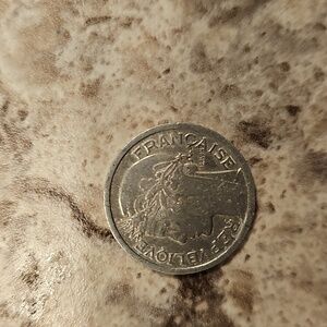Pink Textured Surface with Coin